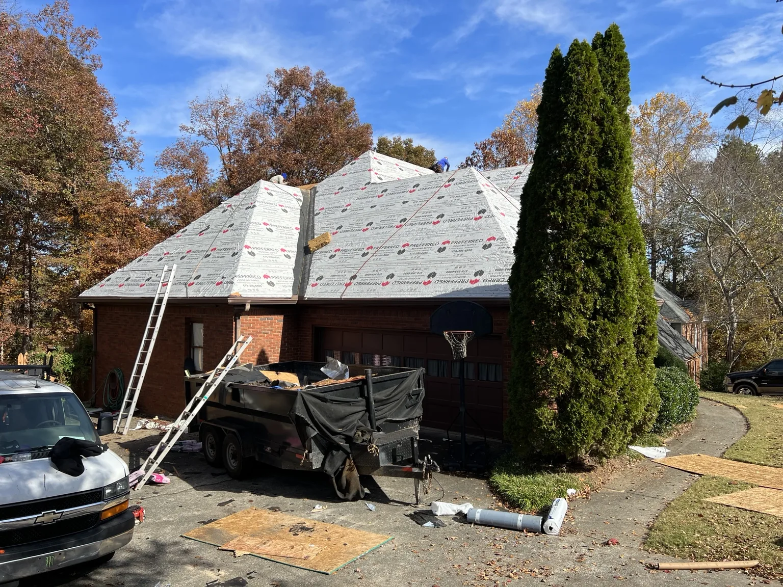 Roof replacement in progress with underlayment installed
