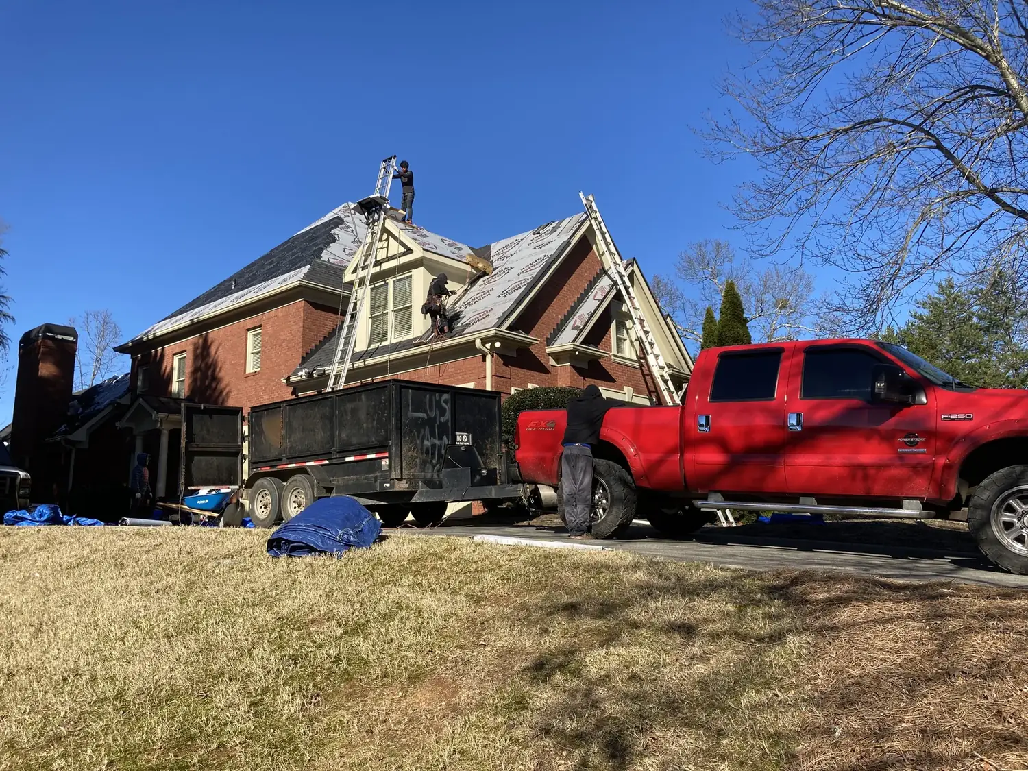 Roofing crew at work on a home