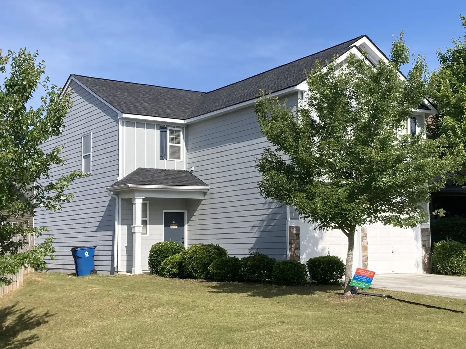 White home, finished roofing project
