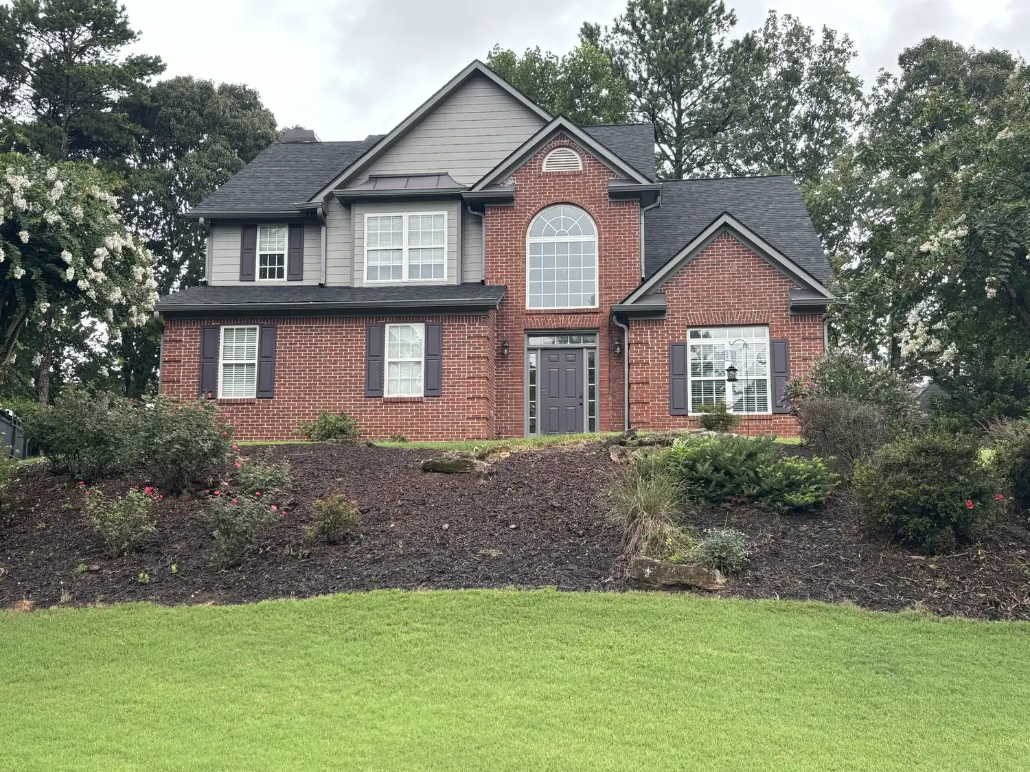 Completed brick home roofing project
